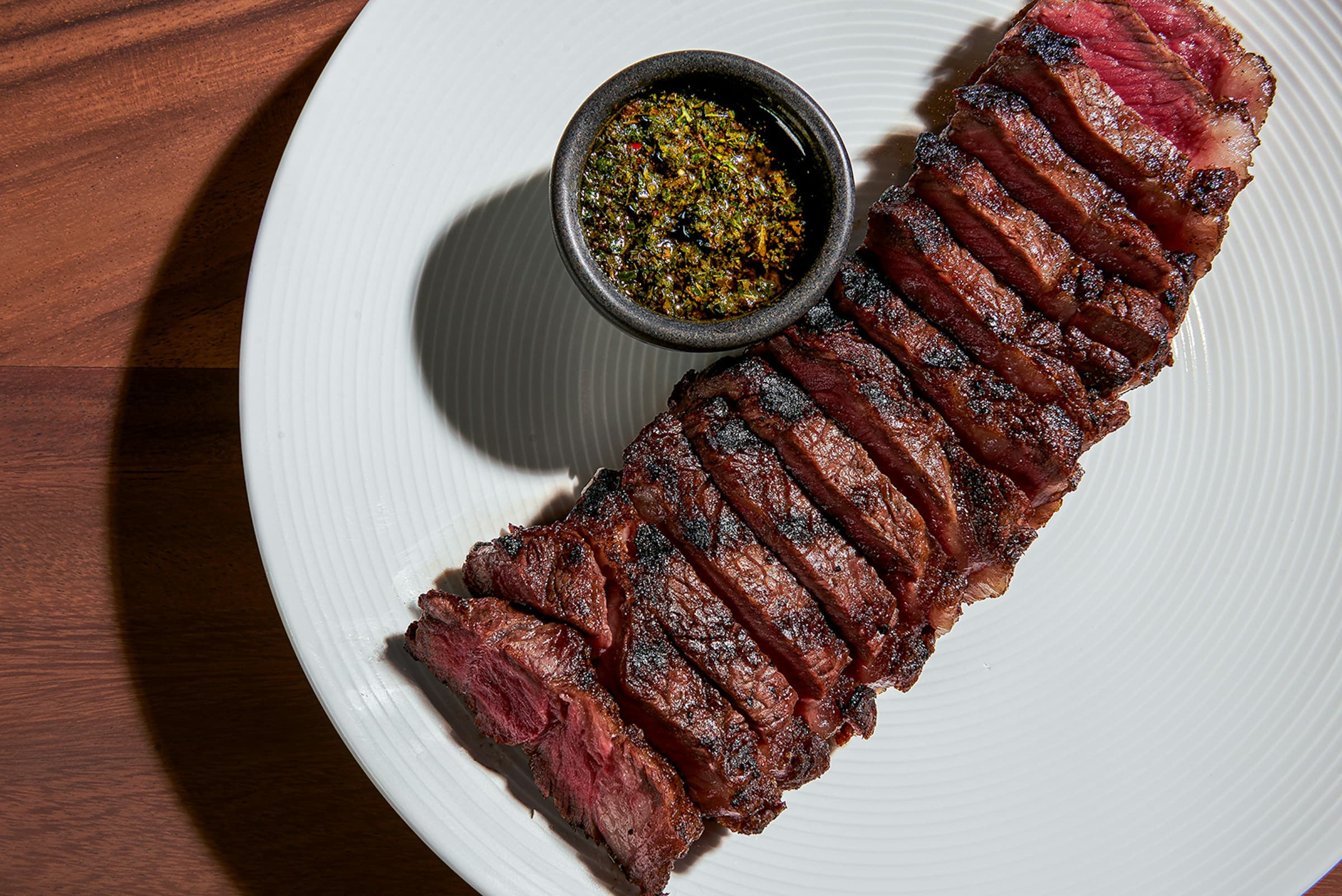 Sliced steak with chimichurri